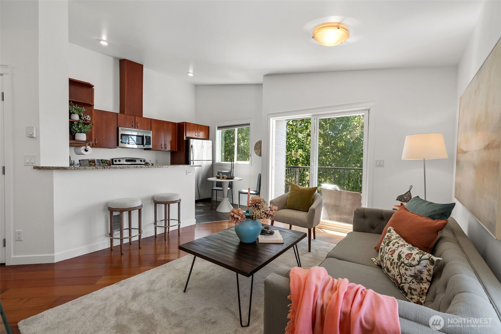 1125 North 93rd Street, Unit 6 Seattle, WA 98103 - Photo 12 of 35 a living room with furniture and a wooden floor