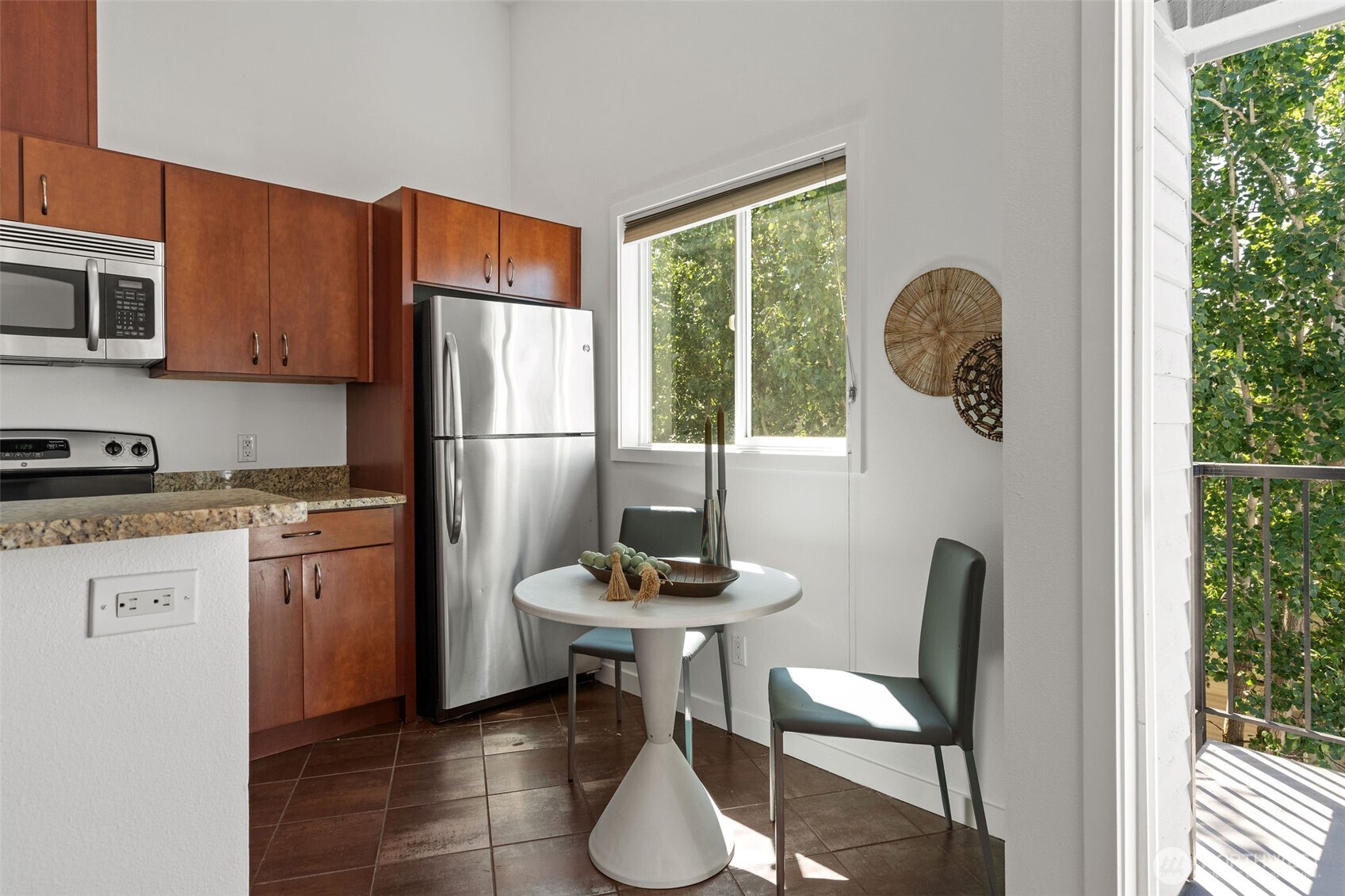 1125 North 93rd Street, Unit 6 Seattle, WA 98103 - Photo 15 of 35 a kitchen with a refrigerator and windows