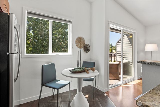 a view of a dining room with furniture window and outside view