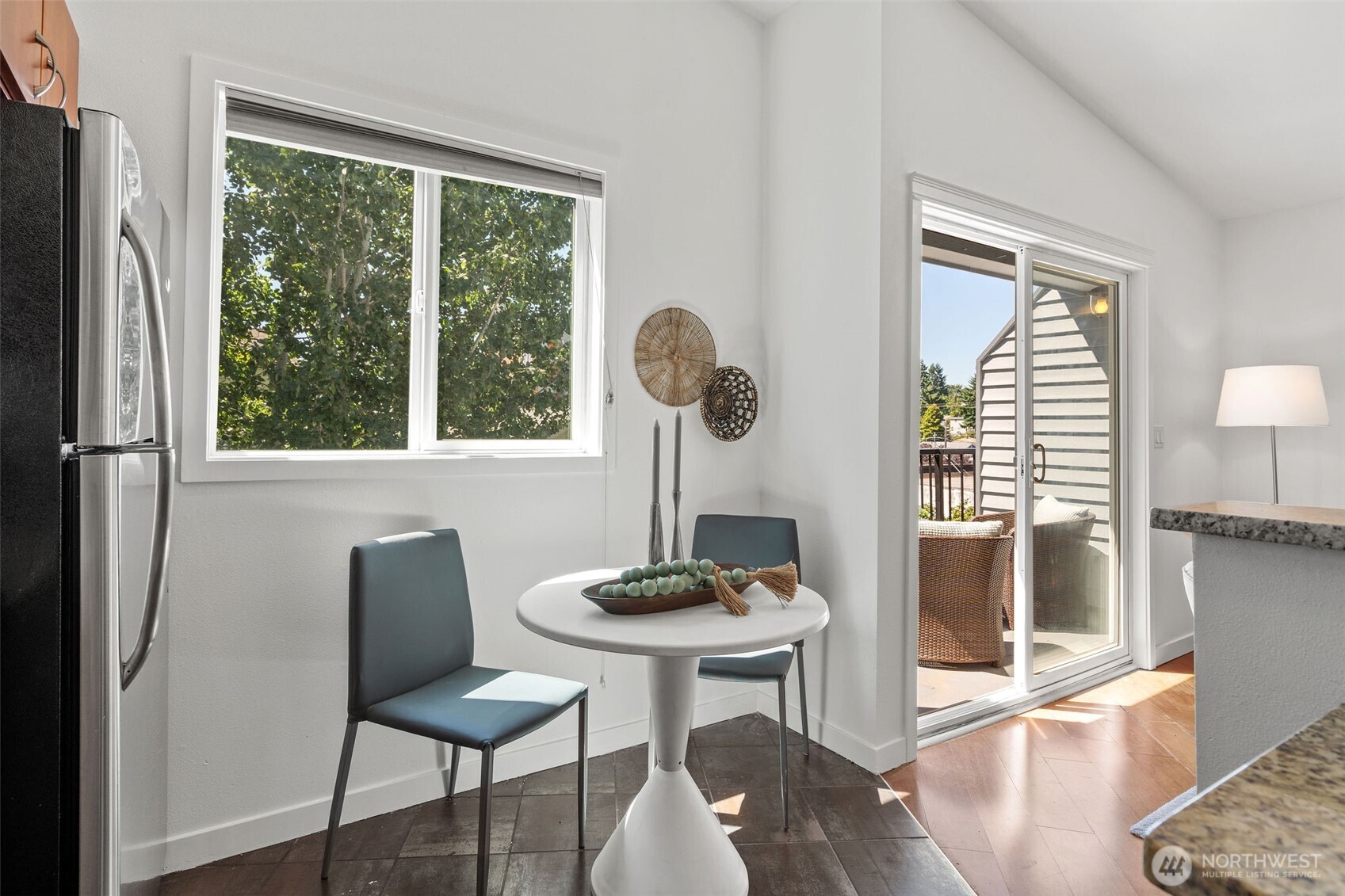 1125 North 93rd Street, Unit 6 Seattle, WA 98103 - Photo 18 of 35 a view of a dining room with furniture window and outside view