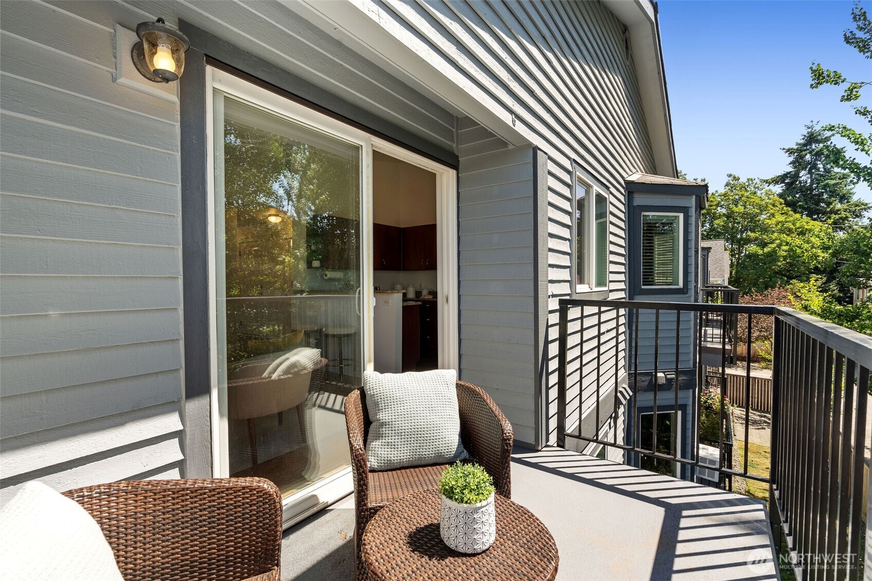 1125 North 93rd Street, Unit 6 Seattle, WA 98103 - Photo 19 of 35 front view of a house with a chairs