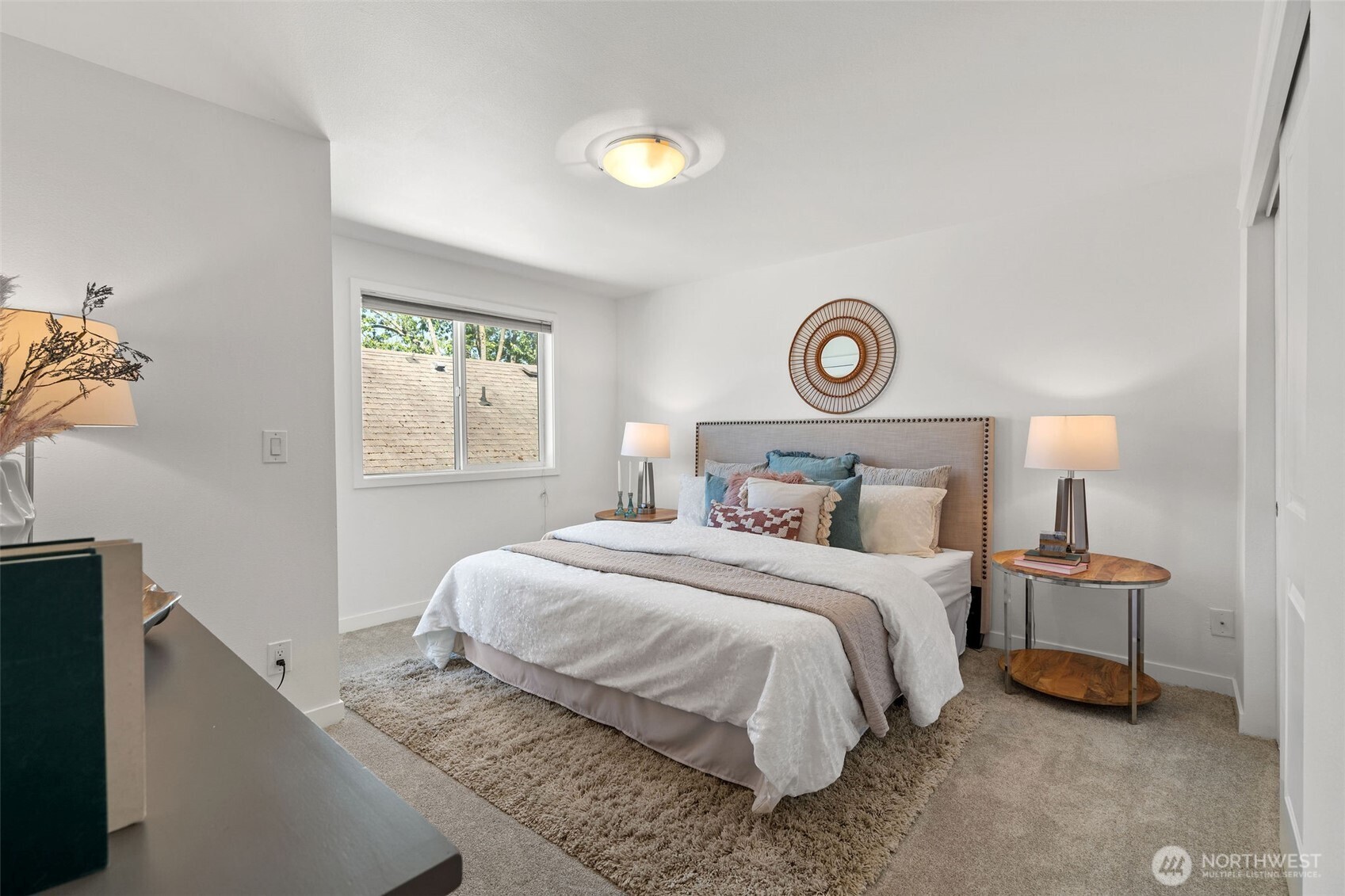 1125 North 93rd Street, Unit 6 Seattle, WA 98103 - Photo 22 of 35 a bedroom with a bed and a window