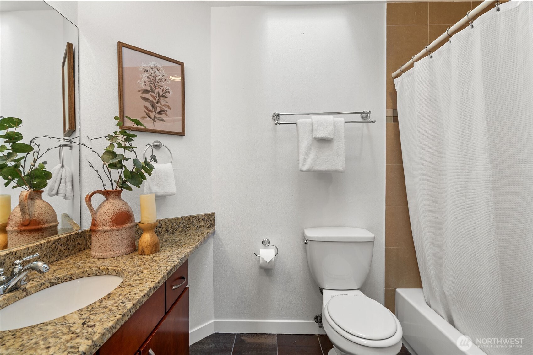 1125 North 93rd Street, Unit 6 Seattle, WA 98103 - Photo 28 of 35 a bathroom with a granite countertop sink mirror vanity and toilet