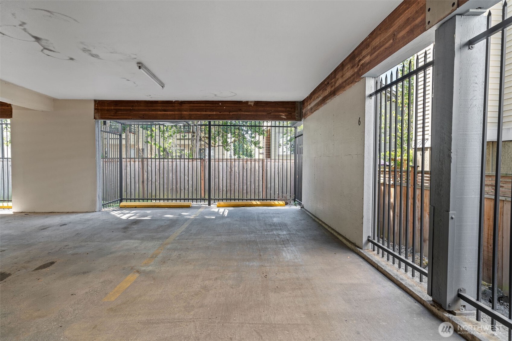 1125 North 93rd Street, Unit 6 Seattle, WA 98103 - Photo 29 of 35 a view of an empty room with a fireplace and a window
