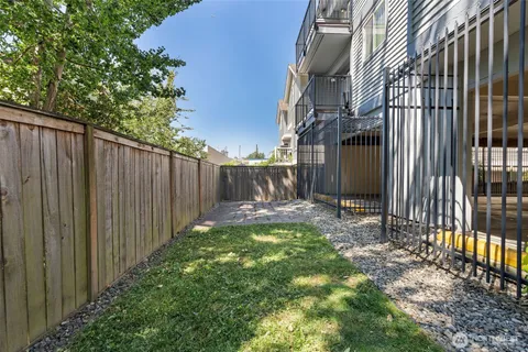 a view of a pathway with a backyard