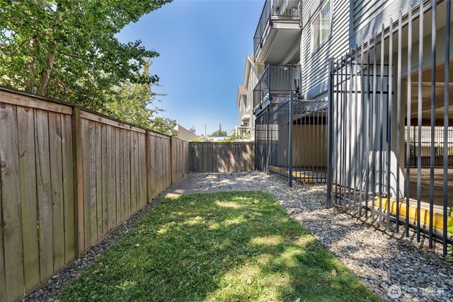 a view of a pathway with a backyard