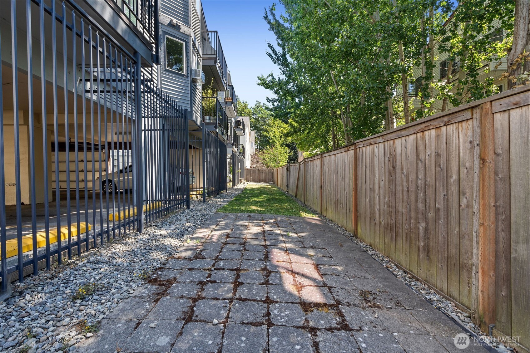 1125 North 93rd Street, Unit 6 Seattle, WA 98103 - Photo 31 of 35 a view of a pathway with a backyard