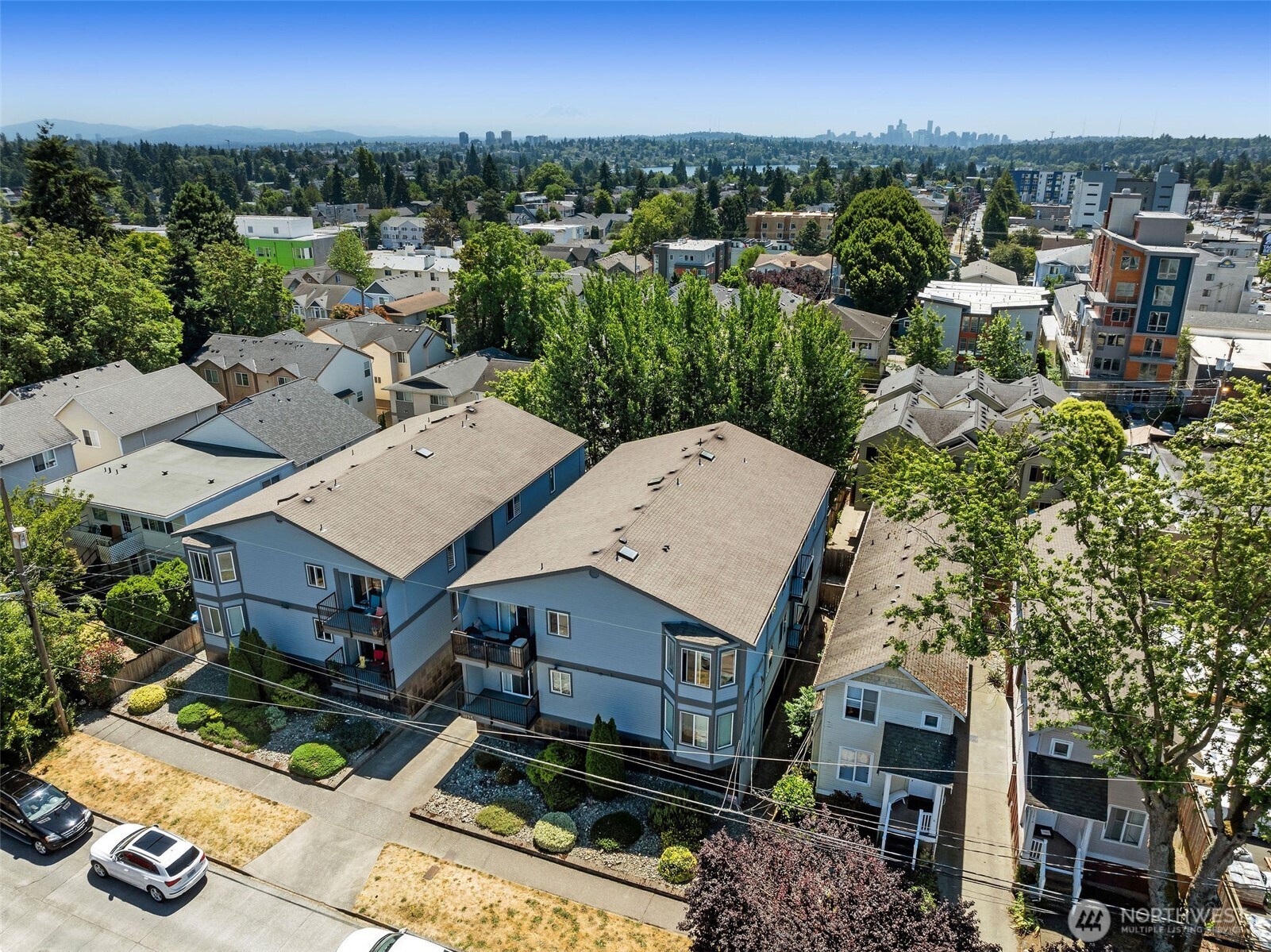 1125 North 93rd Street, Unit 6 Seattle, WA 98103 - Photo 6 of 35 an aerial view of a house with a garden and lake view