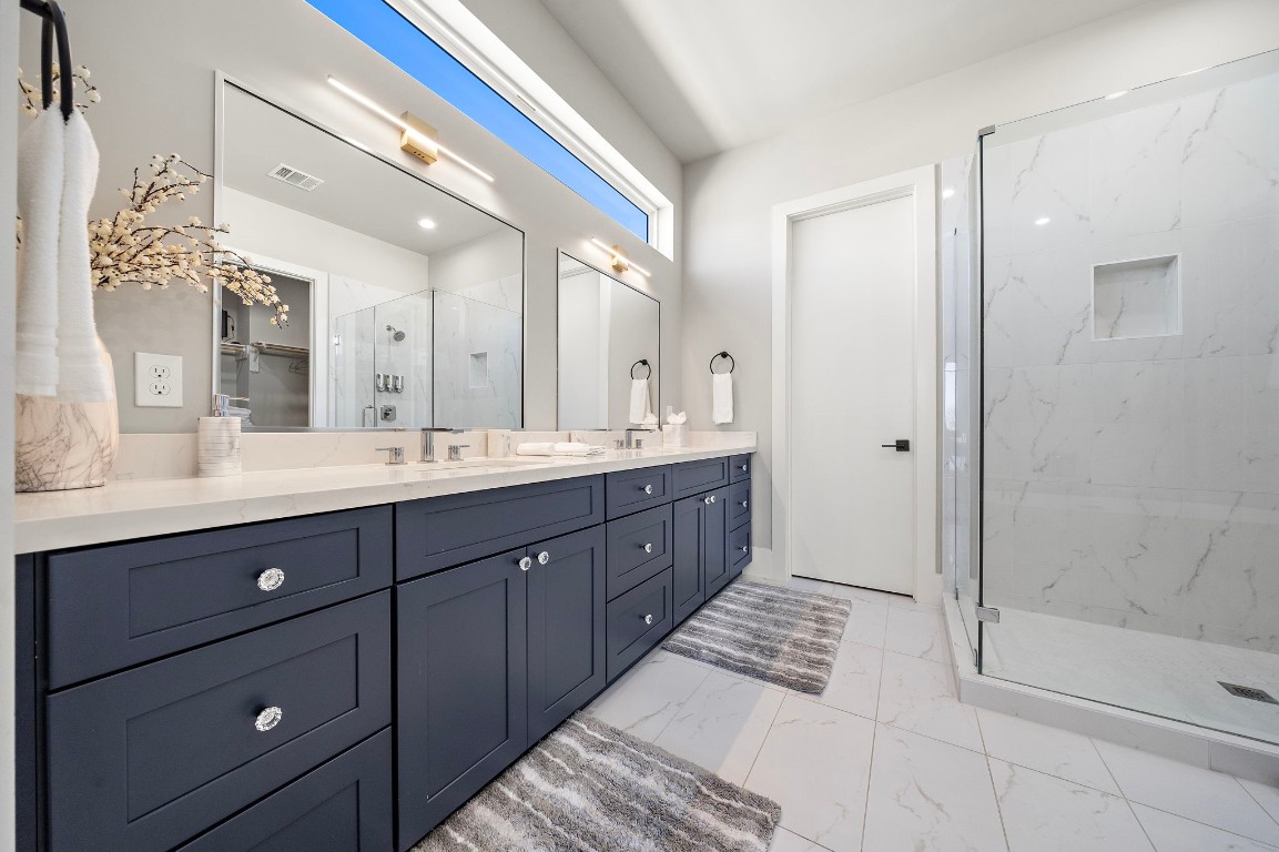 3515 Hutchins Street Houston, TX 77004 - Photo 20 of 35 a spacious bathroom with a double vanity sink mirror and double