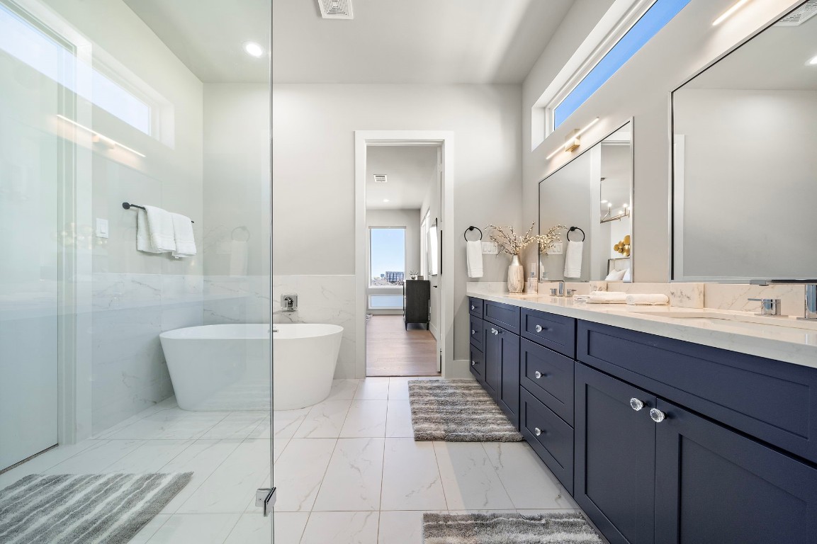 3515 Hutchins Street Houston, TX 77004 - Photo 22 of 35 a spacious bathroom with a tub double sink and mirror