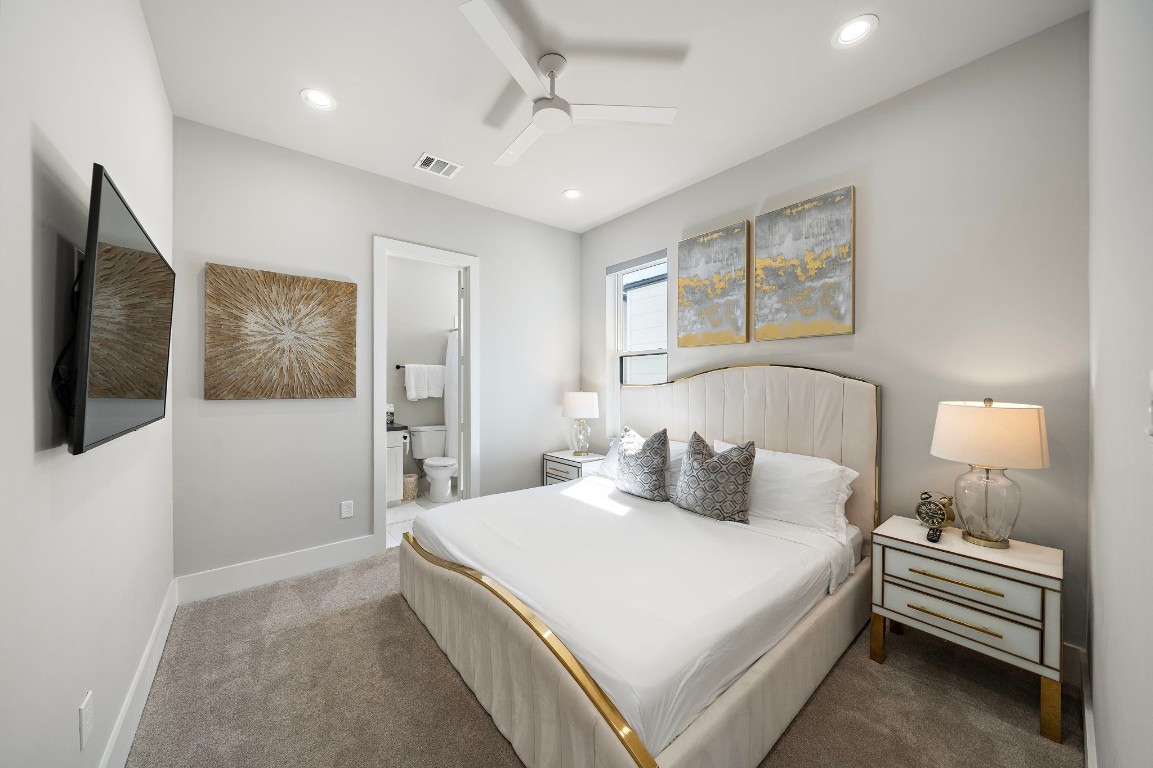 3515 Hutchins Street Houston, TX 77004 - Photo 24 of 35 a bedroom with a bed and a flat screen tv