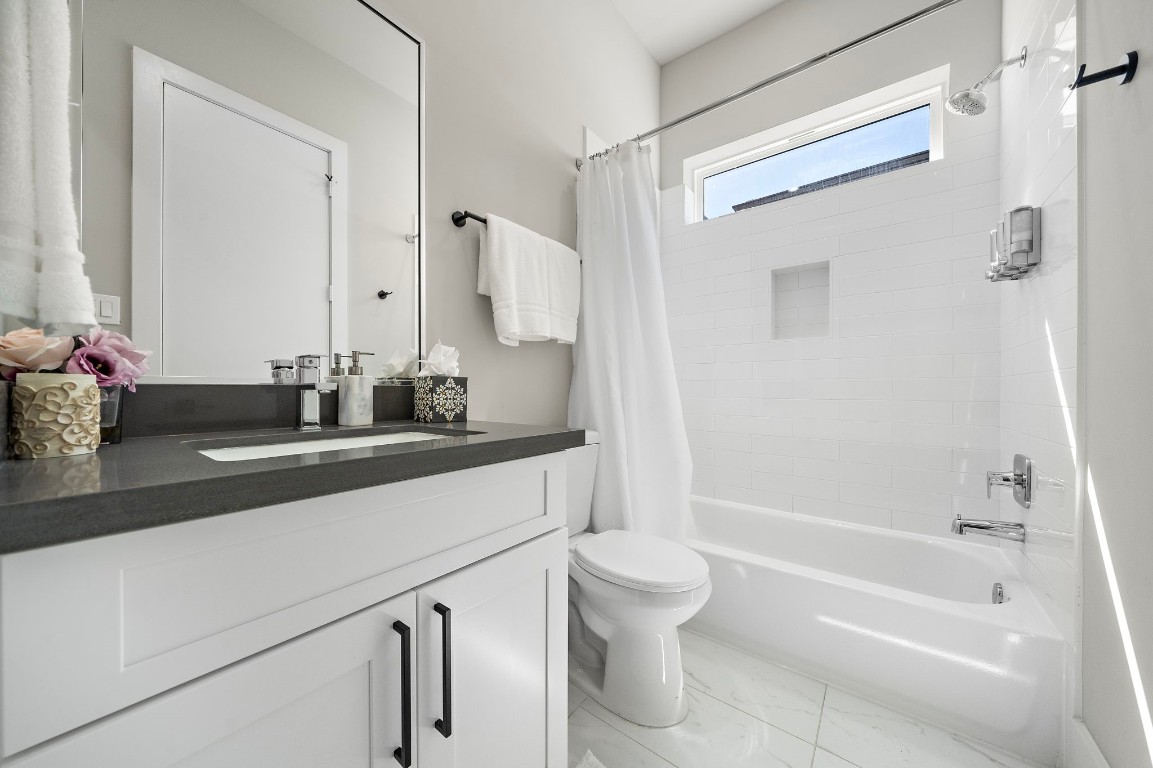 3515 Hutchins Street Houston, TX 77004 - Photo 26 of 35 a bathroom with a sink a toilet and a mirror