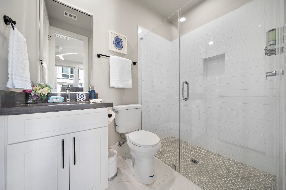 3515 Hutchins Street Houston, TX 77004 - Photo 30 of 35 a bathroom with a sink a toilet and shower