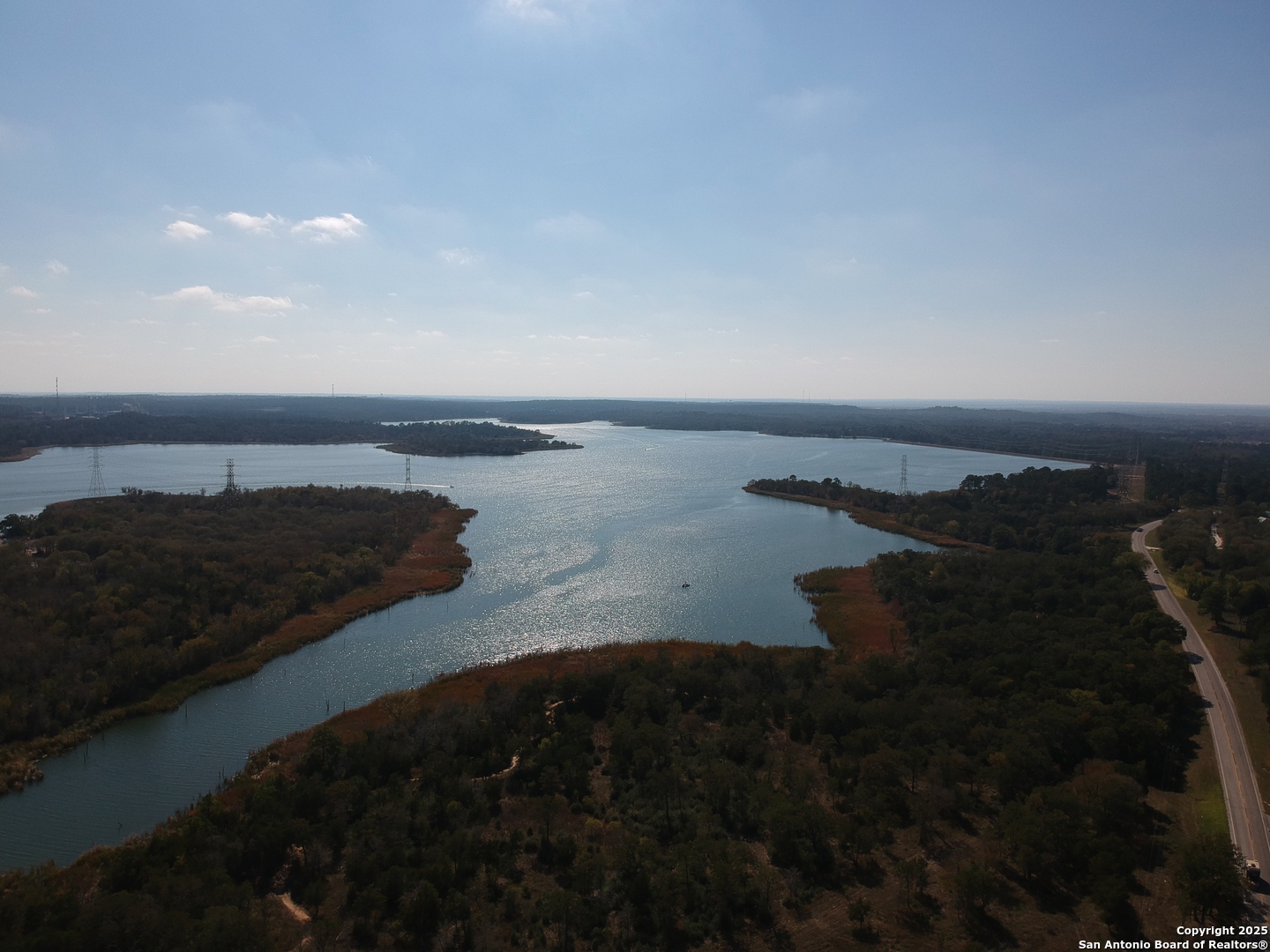 294 Flint Ridge Street Bastrop, TX 78602 - Photo 17 of 17 a view of a lake in middle of the house