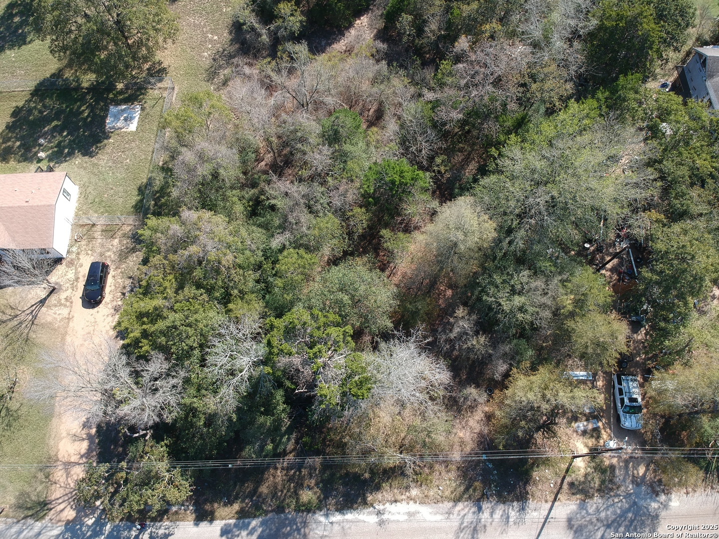 294 Flint Ridge Street Bastrop, TX 78602 - Photo 5 of 17 a view of outdoor space and covered with trees