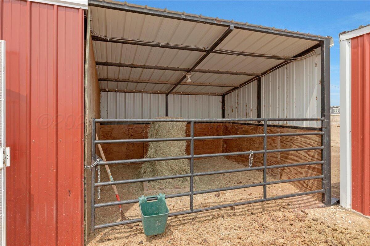 10551 Anderson Road Amarillo, TX 79118 - Photo 9 of 28 a view of a room with shelves