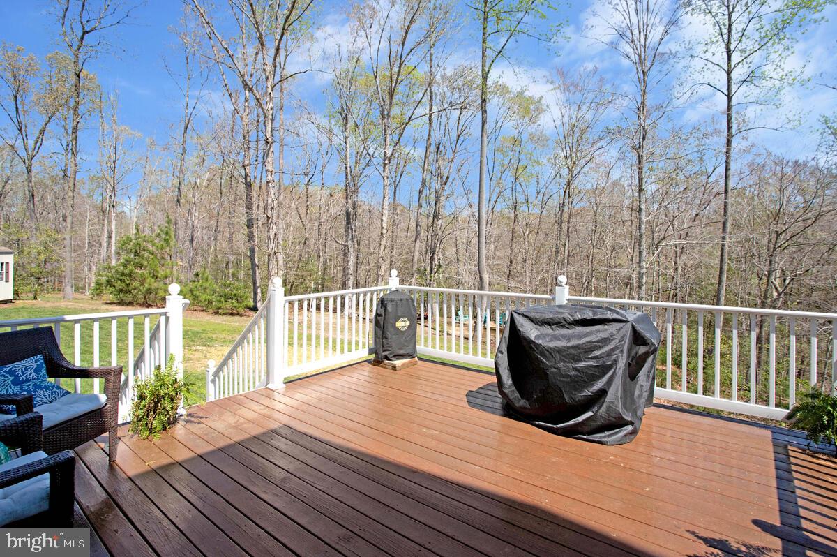 54 Simmons Ridge Road Prince Frederick, MD 20678 - Photo 51 of 55 a view of balcony with wooden floor and outdoor seating