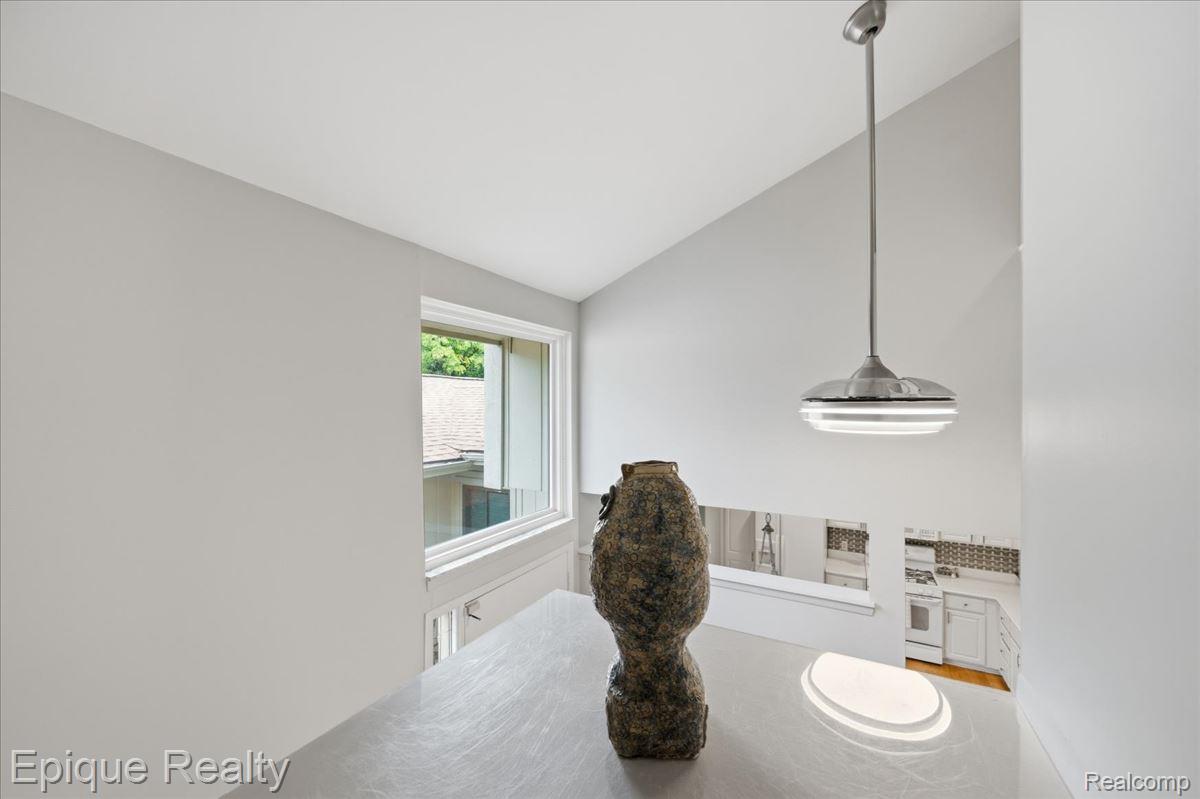 26 Kirks Court Rochester, MI 48309 - Photo 27 of 44 Vaulted ceilings with a contemporary pendant light fixture