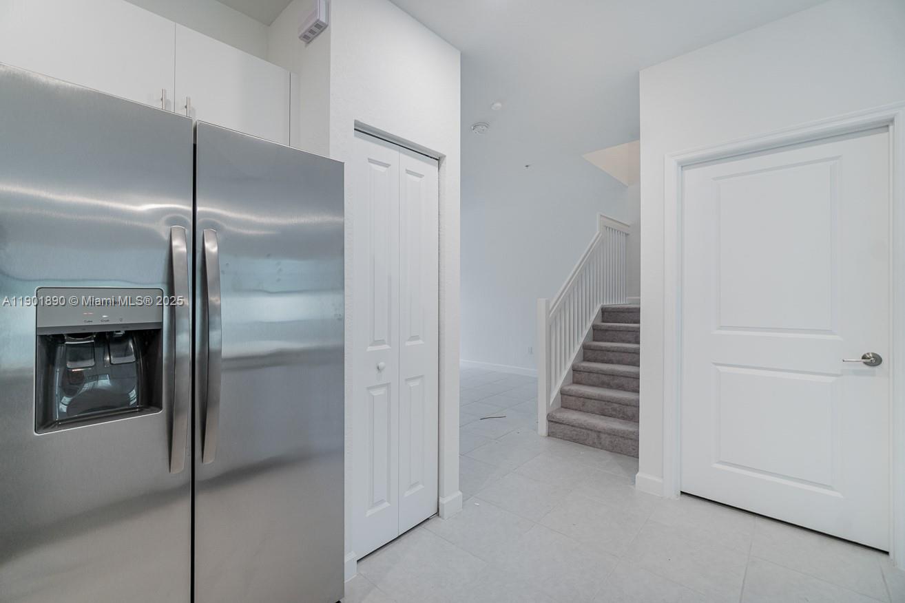 207 Southwest 159th Terrace Pembroke Pines, FL 33027 - Photo 14 of 37 a view of a hallway with staircase