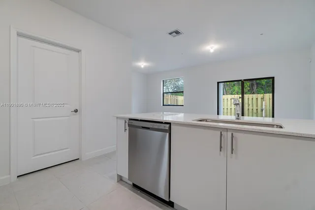 a kitchen with a sink and window