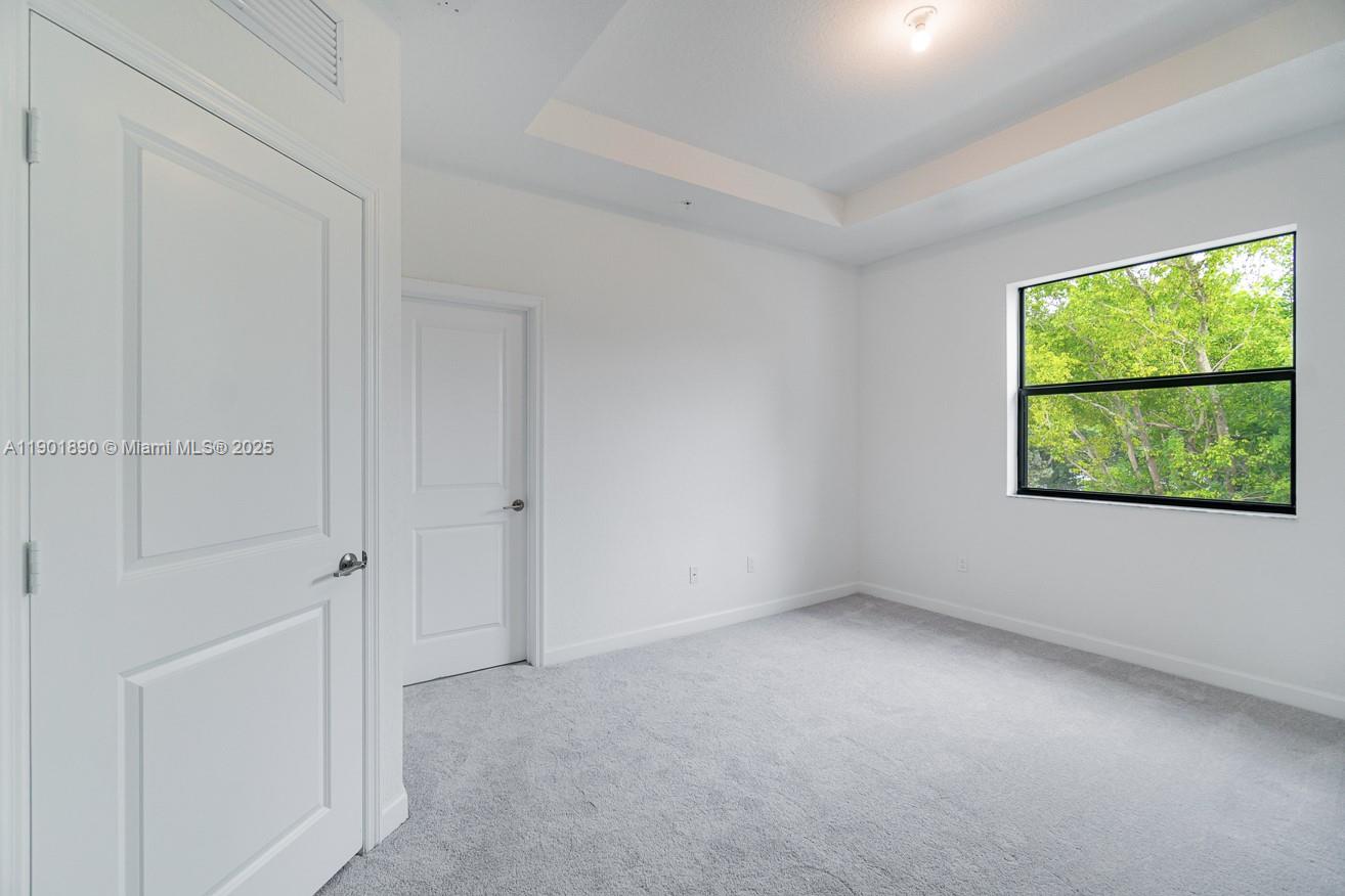 207 Southwest 159th Terrace Pembroke Pines, FL 33027 - Photo 20 of 37 an empty room with windows