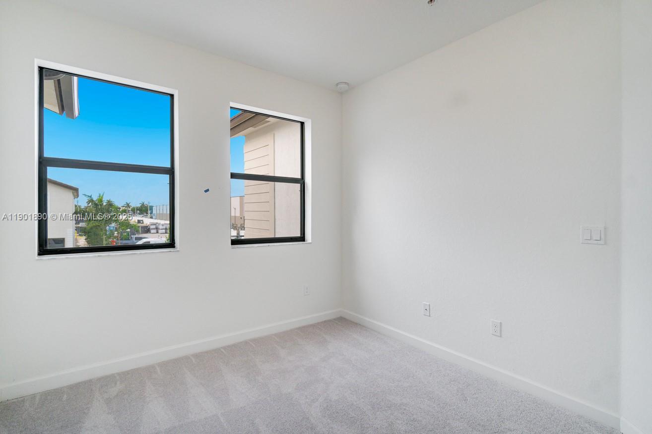 207 Southwest 159th Terrace Pembroke Pines, FL 33027 - Photo 23 of 37 a view of empty room with window