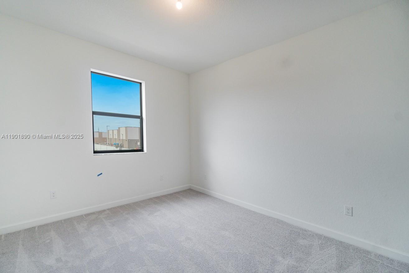 207 Southwest 159th Terrace Pembroke Pines, FL 33027 - Photo 26 of 37 a view of an empty room with a window