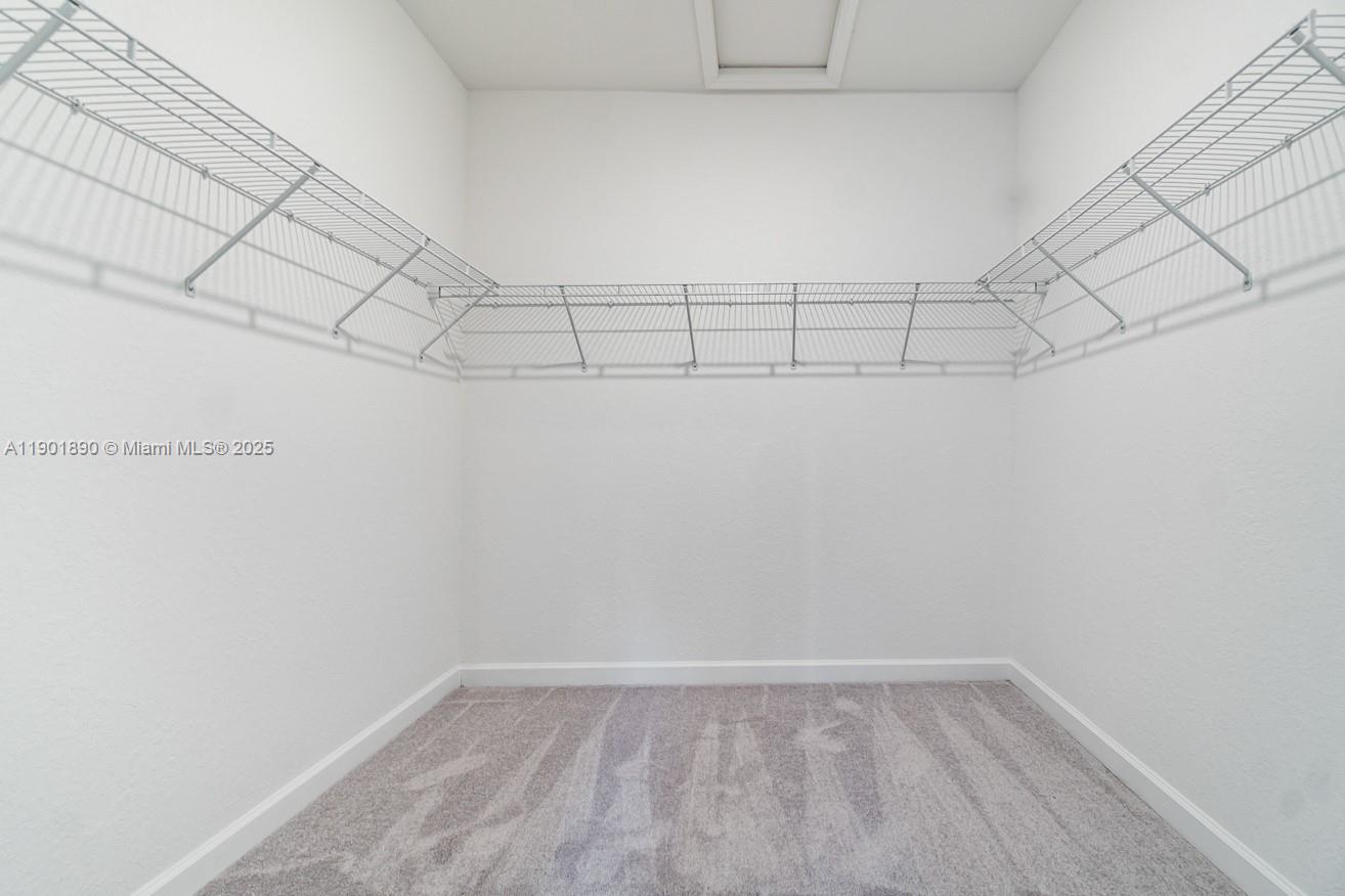 207 Southwest 159th Terrace Pembroke Pines, FL 33027 - Photo 30 of 37 a view of a room with racks on the wall