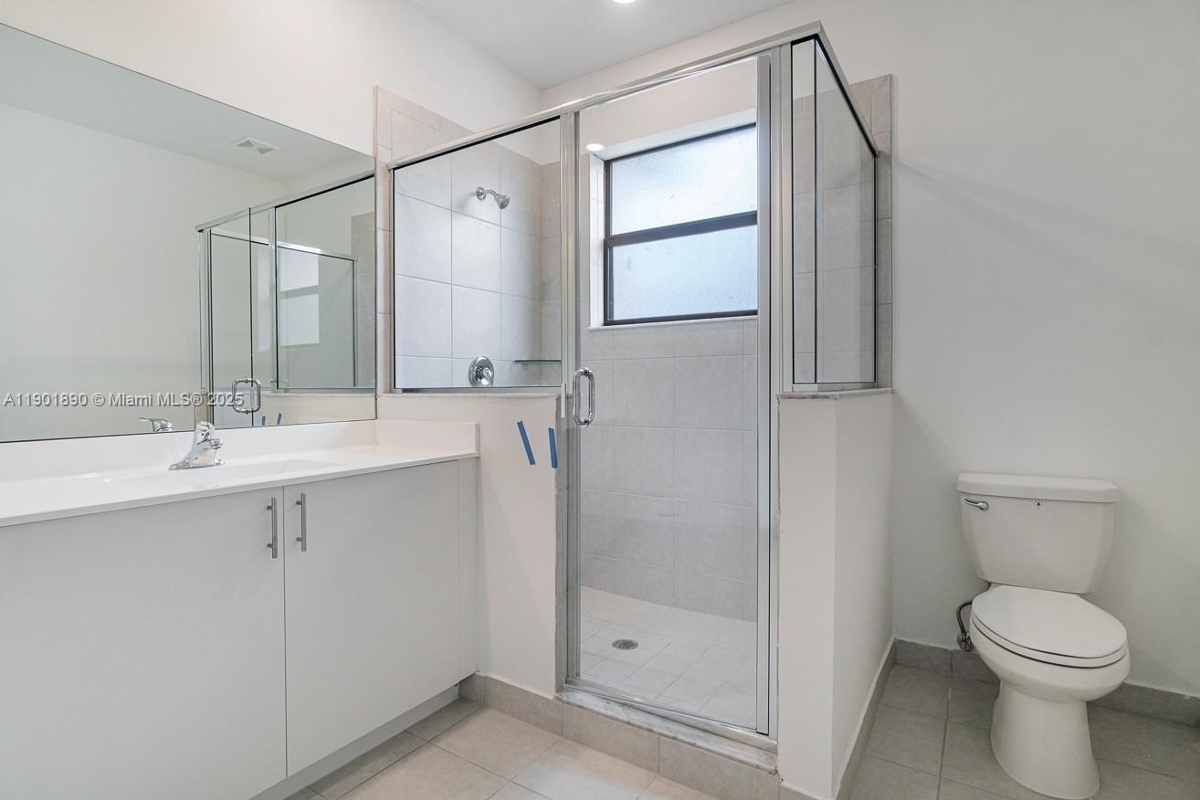 207 Southwest 159th Terrace Pembroke Pines, FL 33027 - Photo 34 of 37 a bathroom with a sink toilet and shower