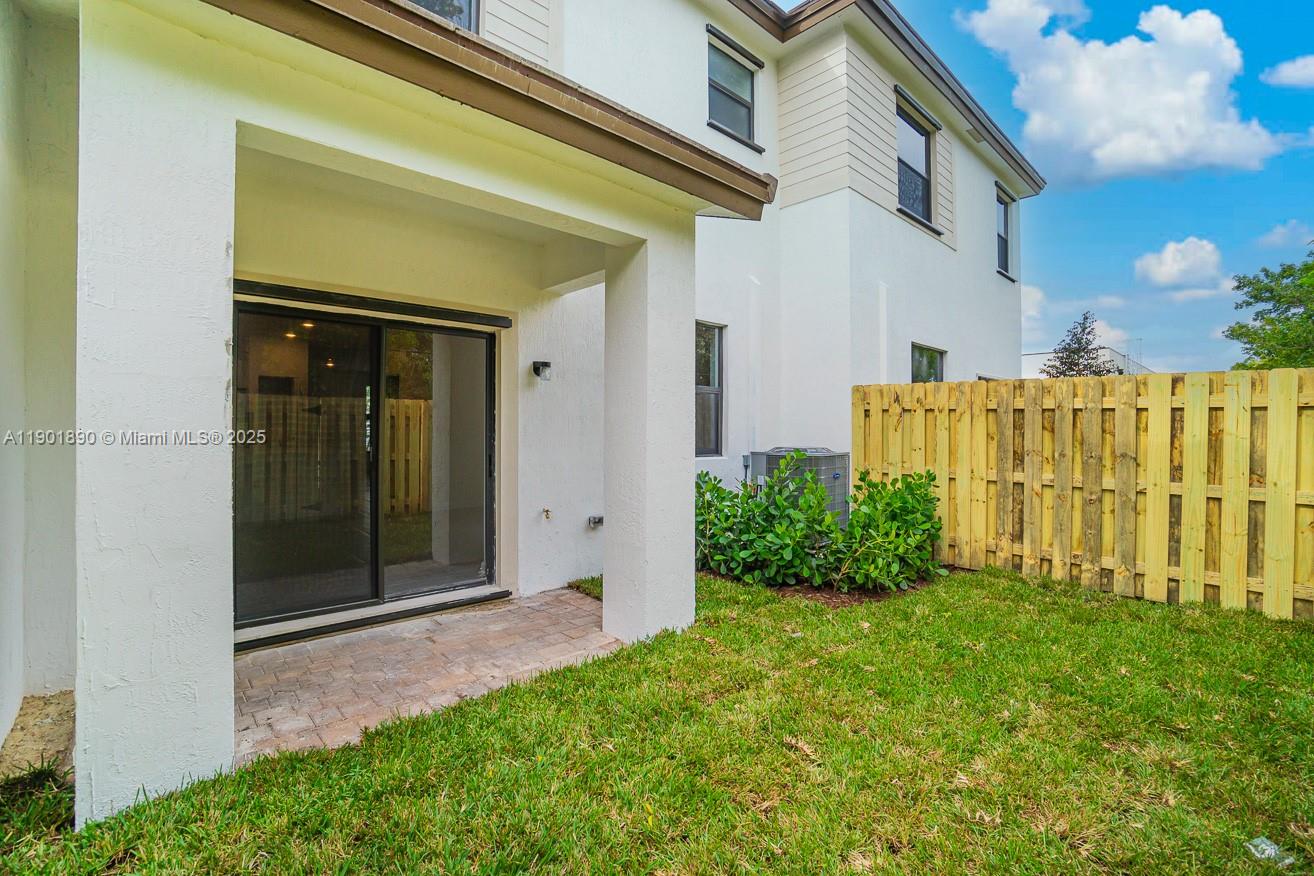 207 Southwest 159th Terrace Pembroke Pines, FL 33027 - Photo 36 of 37 a view of a front of a house having yard