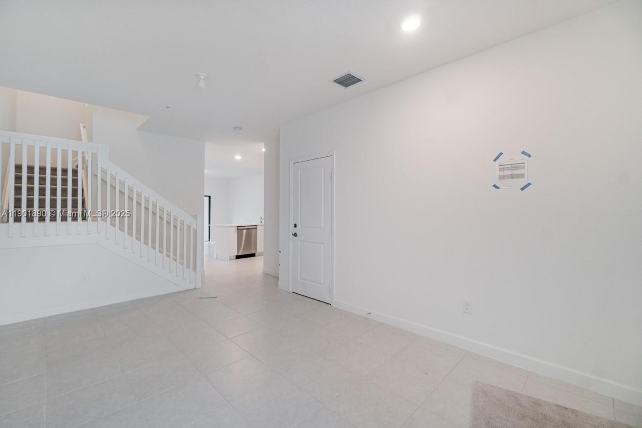 207 Southwest 159th Terrace Pembroke Pines, FL 33027 - Photo 7 of 37 a view of a hallway