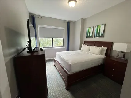 a bedroom with a bed and a walk in closet