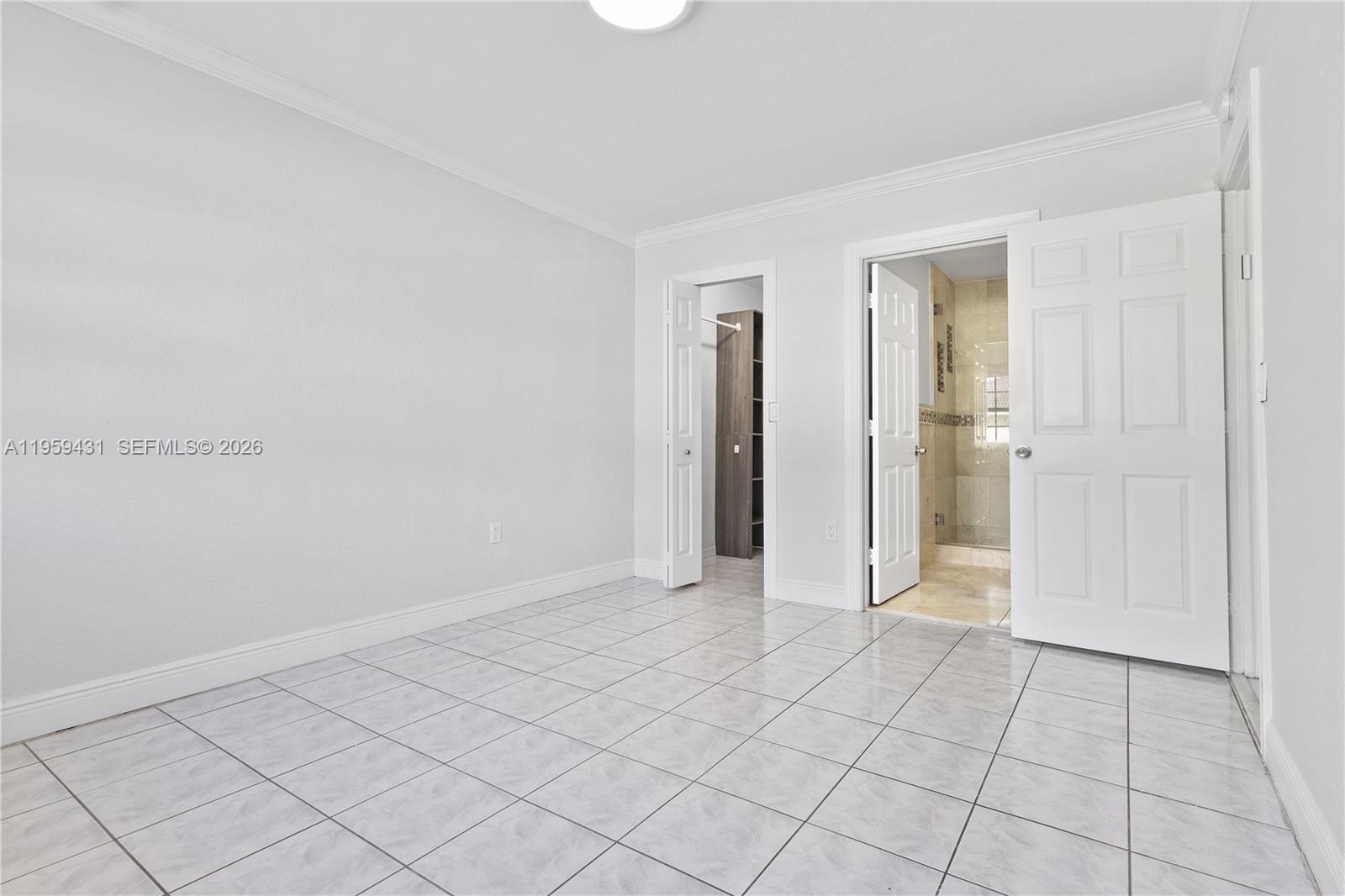 6765 Northwest 182nd Street, Unit 104 Hialeah, FL 33015 - Photo 12 of 24 a view of a room with white walls