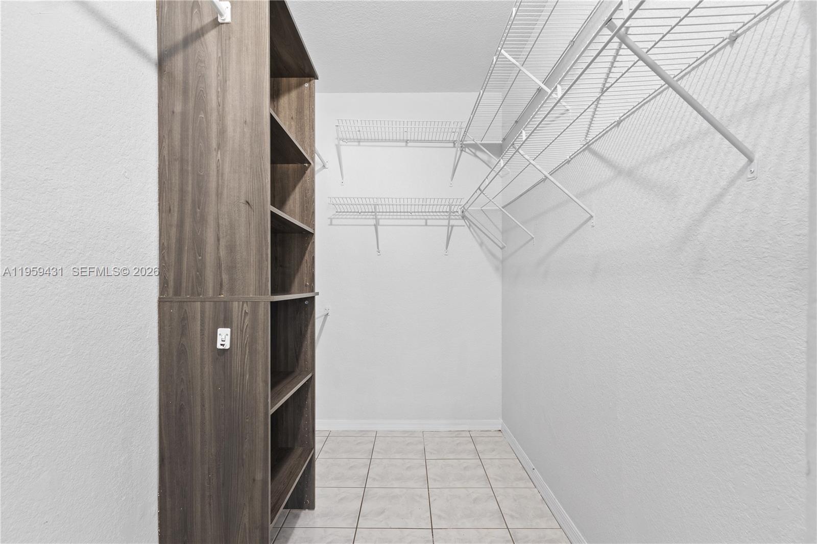 6765 Northwest 182nd Street, Unit 104 Hialeah, FL 33015 - Photo 14 of 24 a view of closet
