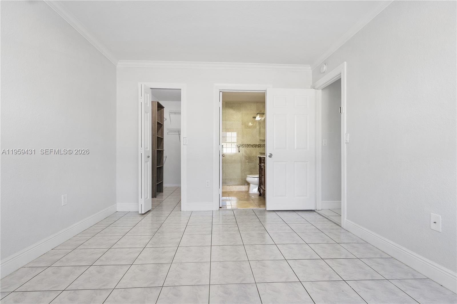 6765 Northwest 182nd Street, Unit 104 Hialeah, FL 33015 - Photo 15 of 24 a view of an empty room and closet area
