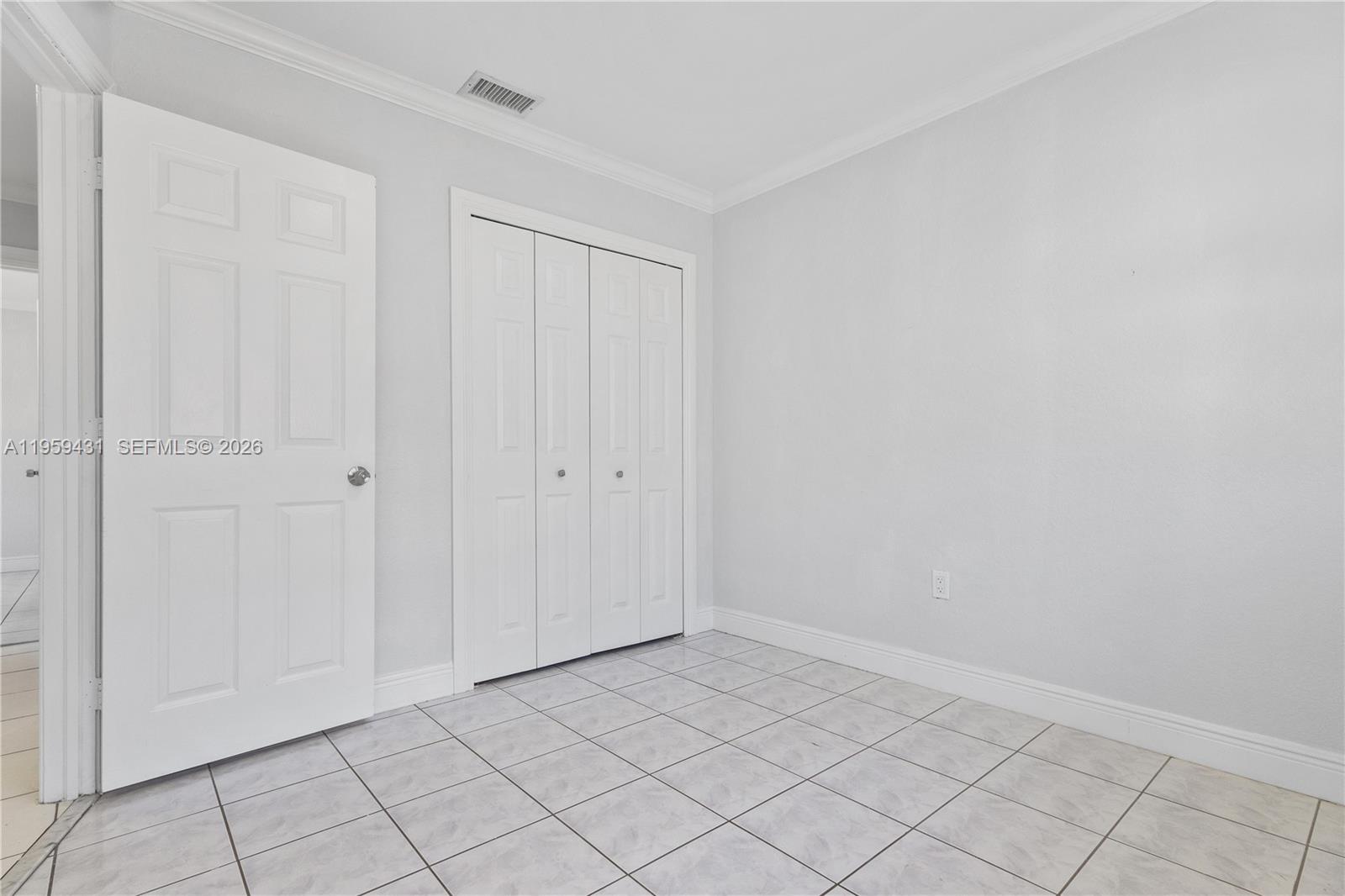 6765 Northwest 182nd Street, Unit 104 Hialeah, FL 33015 - Photo 18 of 24 a view of an empty room