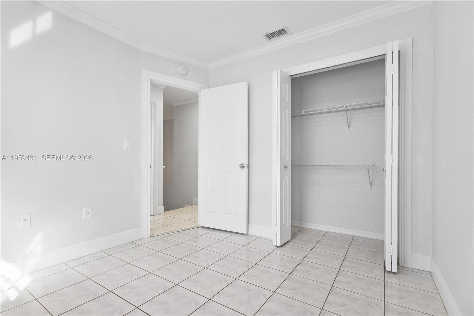 6765 Northwest 182nd Street, Unit 104 Hialeah, FL 33015 - Photo 20 of 24 a view of an empty room