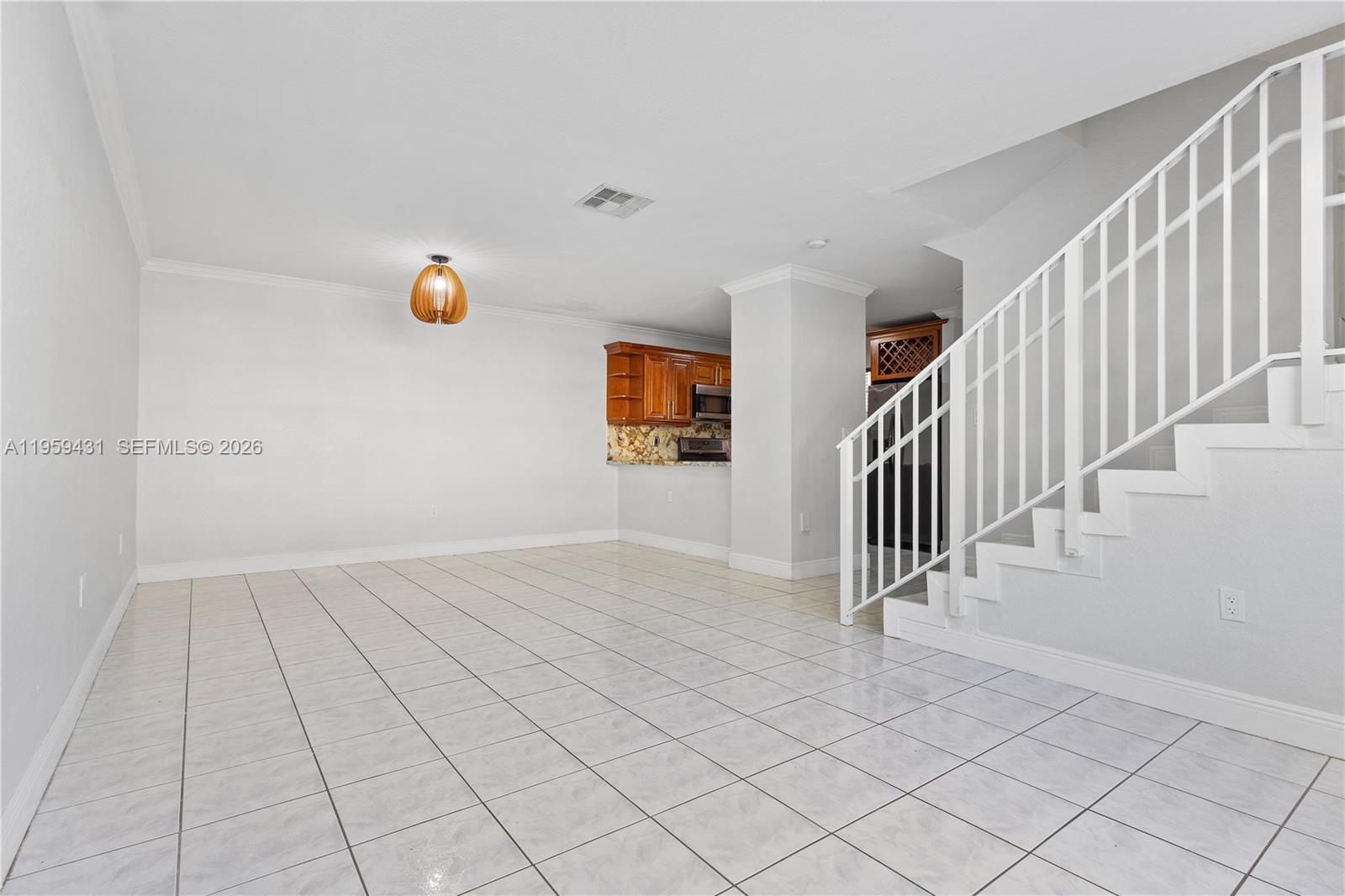 6765 Northwest 182nd Street, Unit 104 Hialeah, FL 33015 - Photo 8 of 24 wooden floor in an empty room