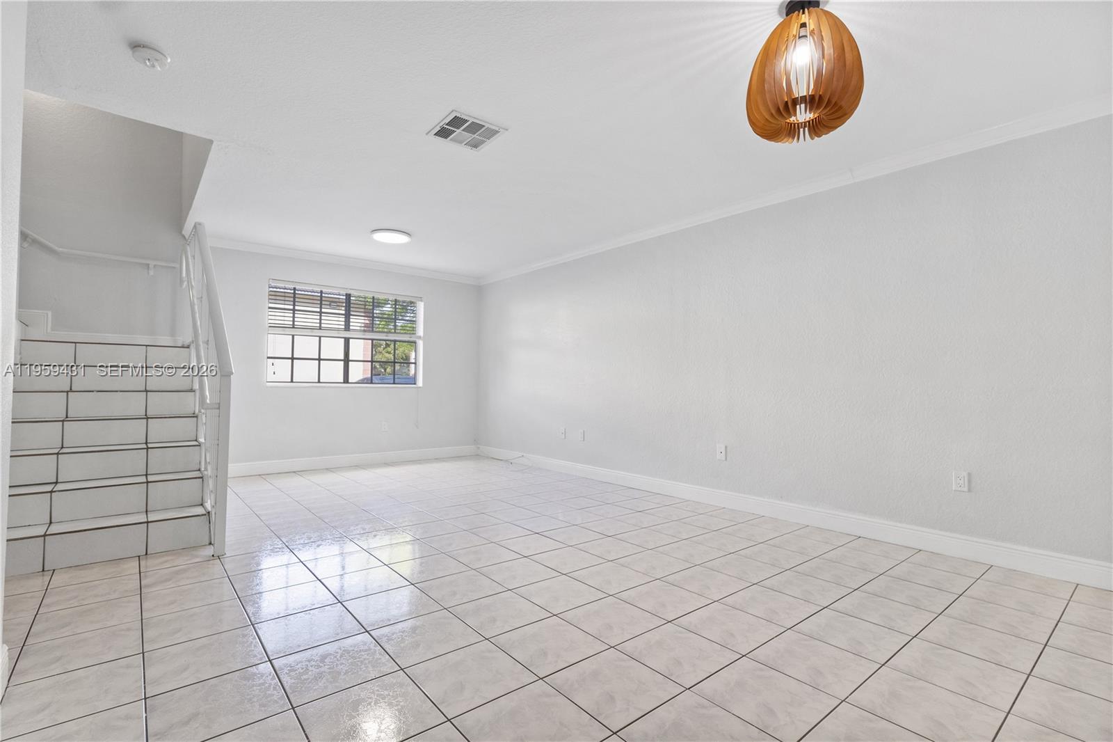 6765 Northwest 182nd Street, Unit 104 Hialeah, FL 33015 - Photo 10 of 24 an empty room with windows