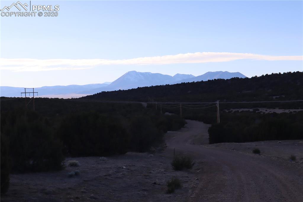 Lot 120 Bear Ridge Road Walsenburg, CO 81089 - Photo 24 of 38 a view of a street with a mountain in the background
