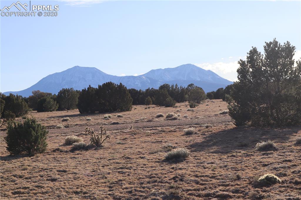 Lot 120 Bear Ridge Road Walsenburg, CO 81089 - Photo 8 of 38 a view of a road with a house in the background