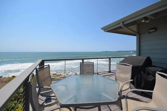 a view of a balcony with chairs