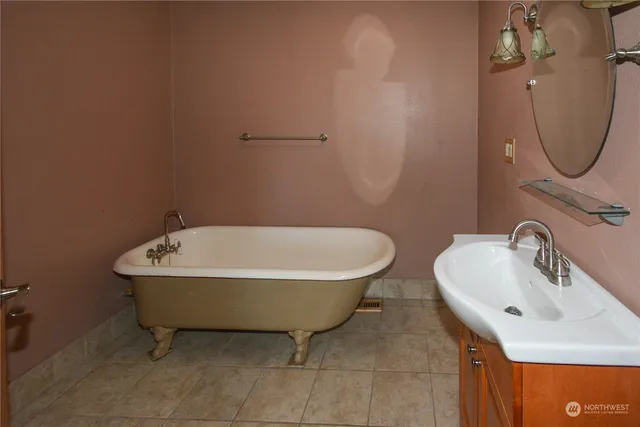 a bathroom with a sink and mirror