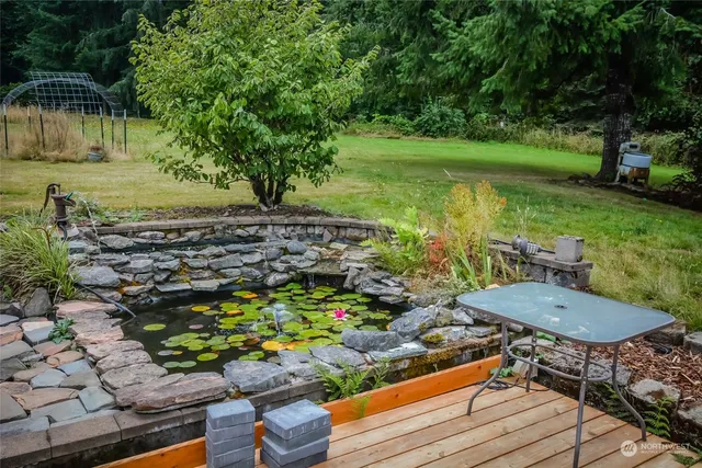 a view of a chairs and table in the garden