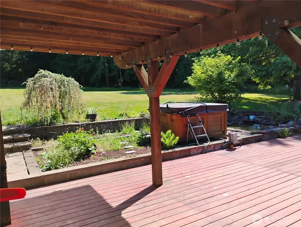 a view of outdoor space with wooden floor and seating