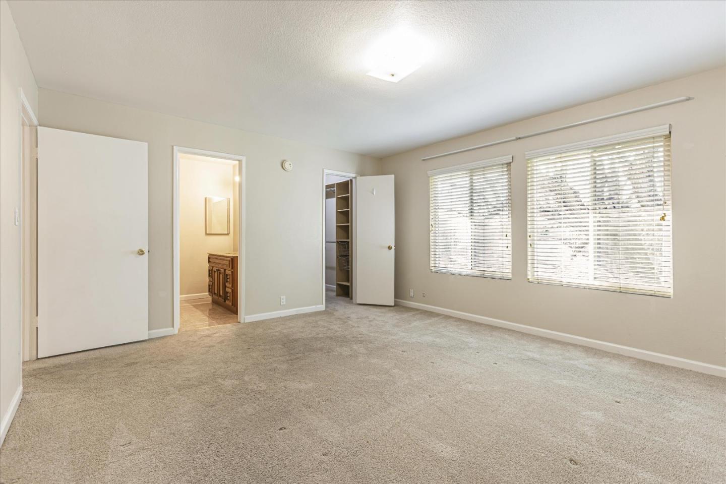 4260 Clayton Road, Unit 20 Concord, CA 94521 - Photo 14 of 35 an empty room with windows and closet