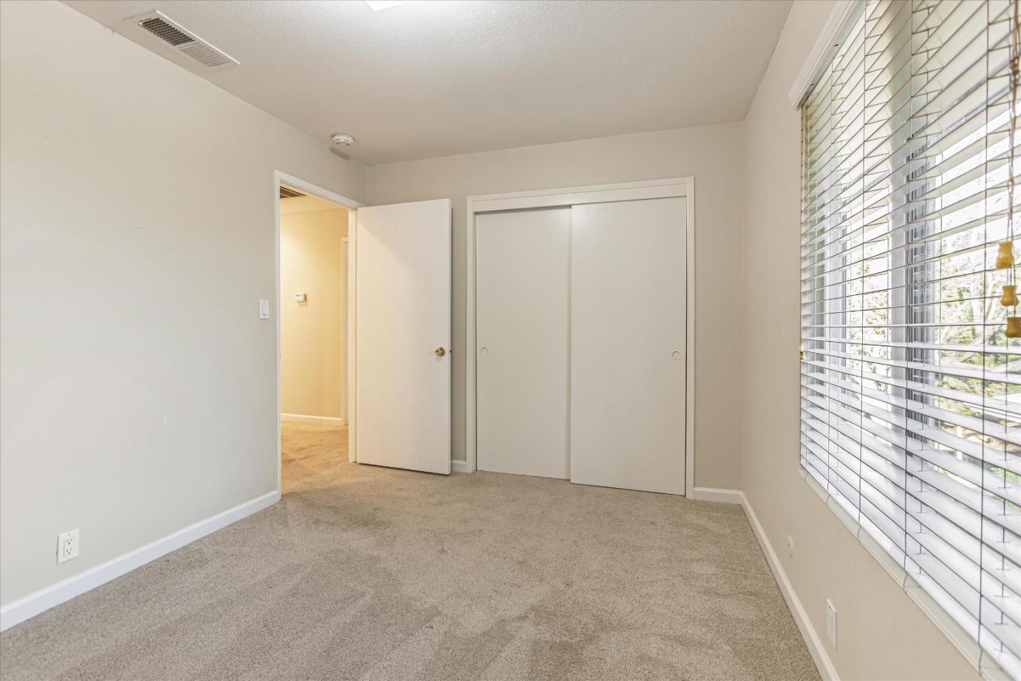 4260 Clayton Road, Unit 20 Concord, CA 94521 - Photo 22 of 35 a view of an empty room and a window