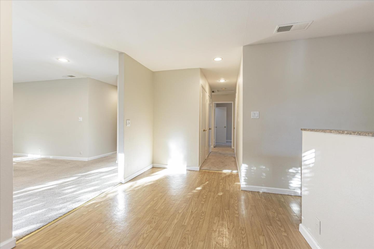 4260 Clayton Road, Unit 20 Concord, CA 94521 - Photo 8 of 35 a view of a big room with wooden floor and windows
