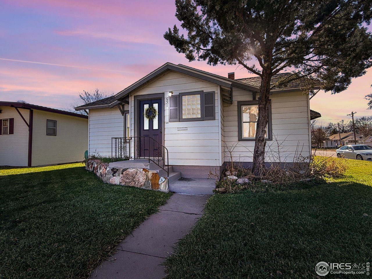 531 Taylor Street Sterling, CO 80751 - Photo 1 of 38 a front view of house with yard and green space