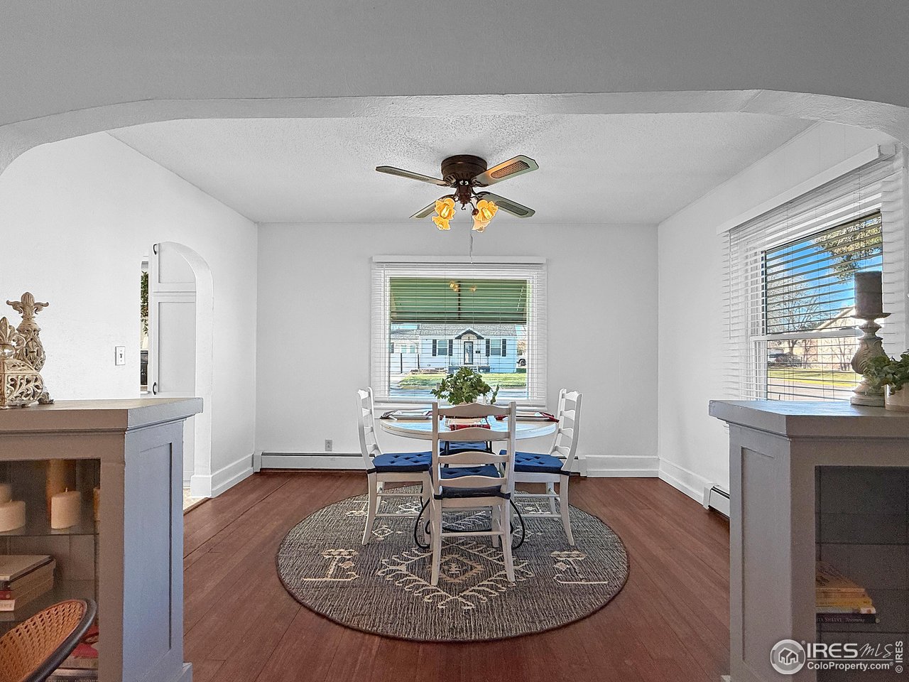 531 Taylor Street Sterling, CO 80751 - Photo 14 of 38 a view of a dining room with furniture window and wooden floor